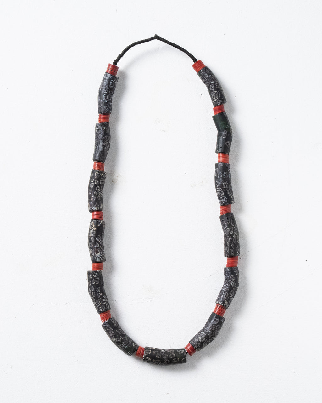 Antique trade beads made of Venetian glass. Banana-shaped beads from