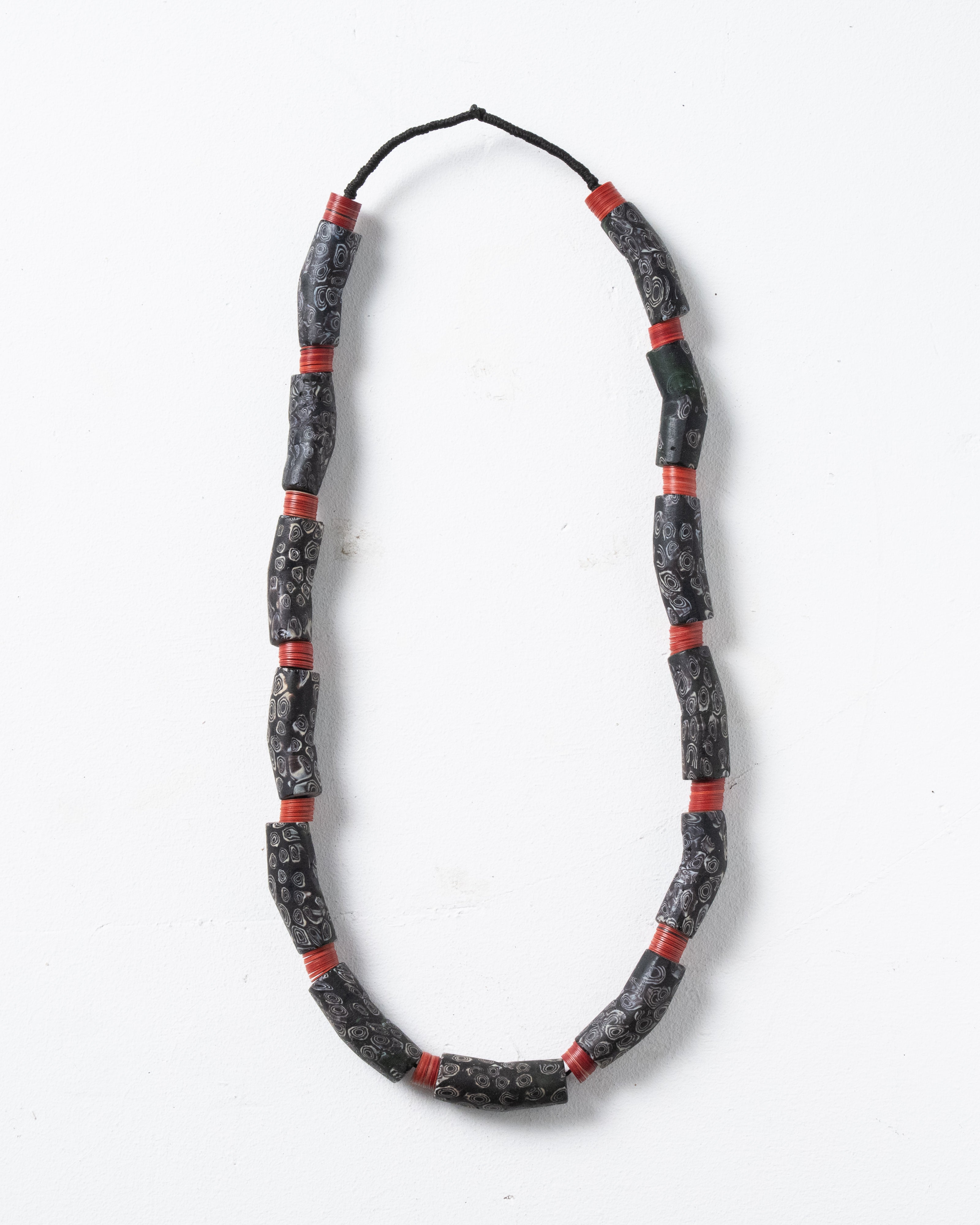 Antique trade beads made of Venetian glass. Banana-shaped beads from