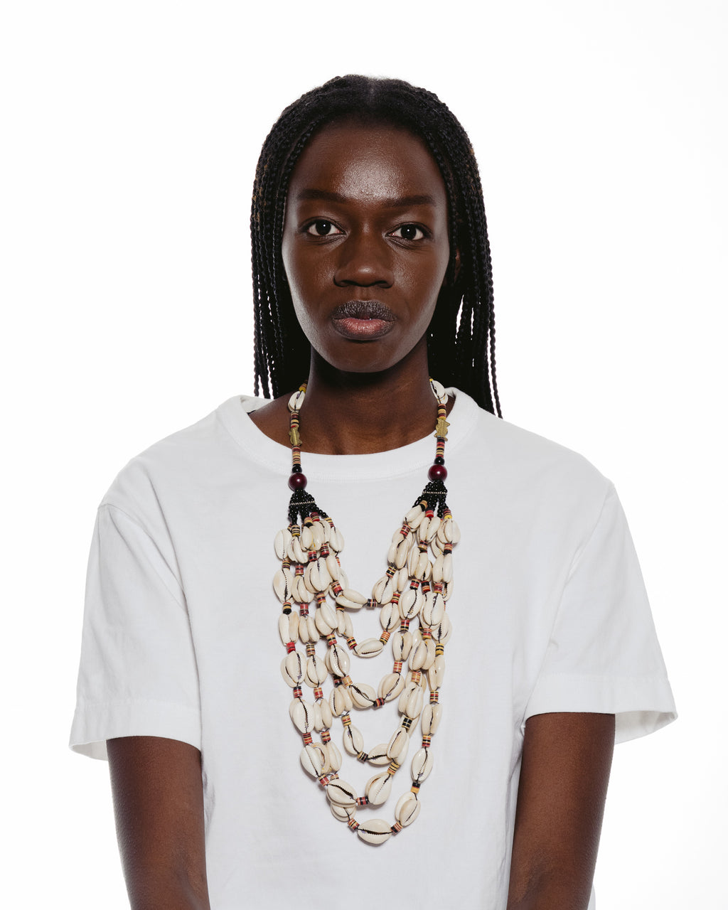 A six-strand Necklace featuring Traditional West African Cowrie Shells